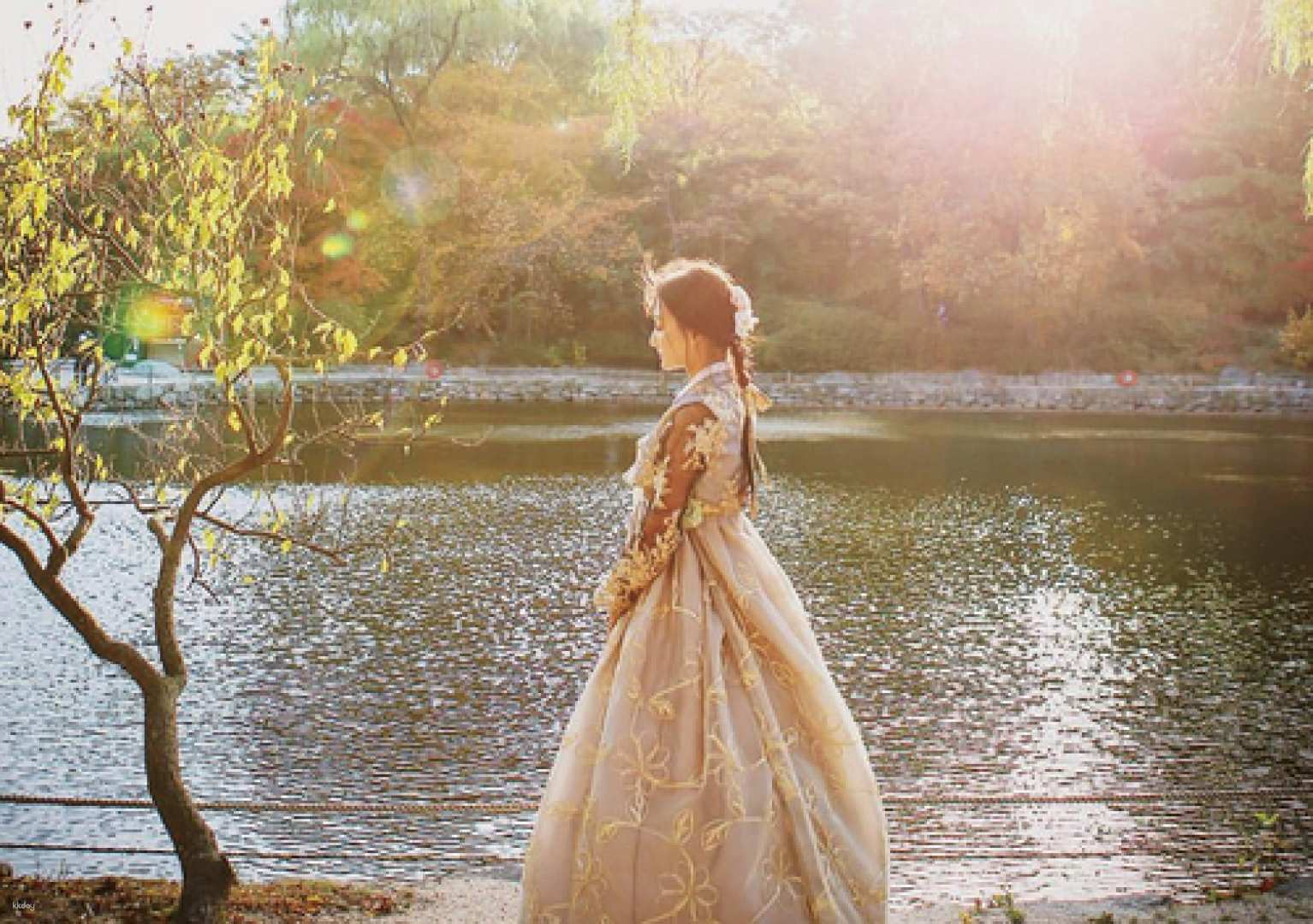 Experience the elegance of traditional Korean attire by the serene waters where every moment in a Palace Fox Hanbok transforms your visit to a historic gem in Seoul.